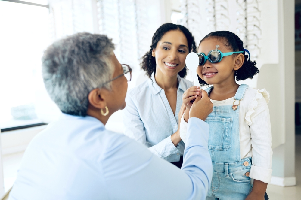 Young girl having an eye exam - Eye Exam in Holly Springs